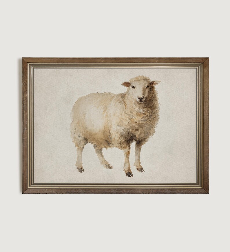 May include: Watercolor painting of a sheep in a wooden frame. The sheep is depicted in shades of white and tan, with a fluffy coat and standing on four legs. The artwork has a vintage, rustic aesthetic.