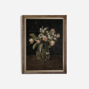 May include: A framed painting of a bouquet of pink roses and white flowers in a clear glass vase on a dark brown background.
