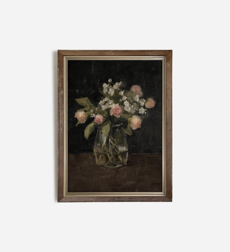 May include: A framed painting of a bouquet of pink roses and white flowers in a clear glass vase on a dark brown background.