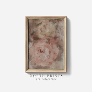 May include: A framed abstract painting of two pink roses with a brown background. The painting is in a light wood frame.