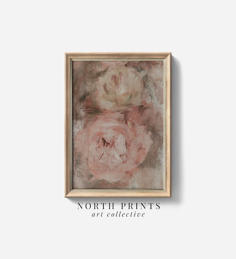 May include: A framed abstract painting of two pink roses with a brown background. The painting is in a light wood frame.