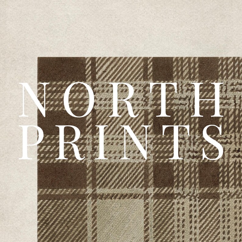 May include: A close-up of a section of a brown and beige plaid pattern fabric. The text "NORTH PRINTS" is overlaid in white, with the letters stacked vertically. The background is a solid beige color.