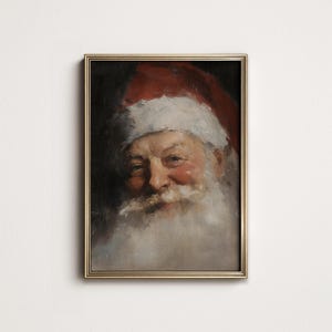 May include: A framed vintage portrait of Santa Claus. The painting features a close-up of Santa's face, with a red hat, white beard, and rosy cheeks. The artwork is set in a gold-colored frame, creating a classic holiday aesthetic.