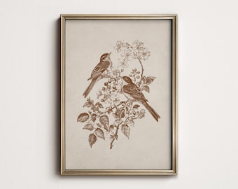 May include: Framed sepia-toned print featuring two birds perched on a flowering branch. The birds and foliage are rendered in a detailed, vintage style. The artwork is enclosed in a gold-colored frame, adding a touch of elegance to the nature-inspired scene.