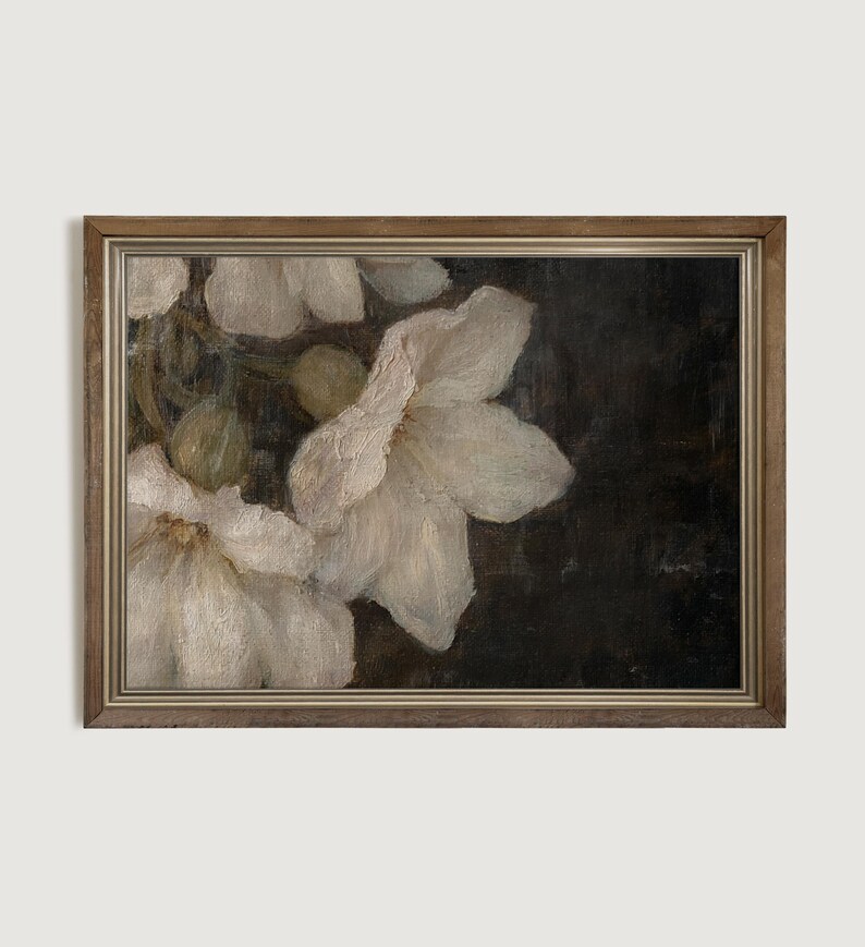 May include: A framed painting of white flowers with a dark background. The flowers are in focus and the background is blurred.