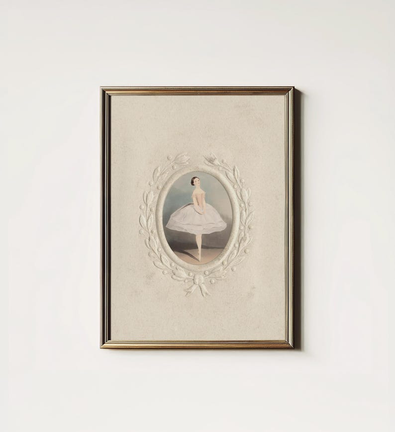May include: A framed vintage print of a ballerina in a white tutu, standing on a stage. The print is surrounded by a decorative white frame with a floral design.
