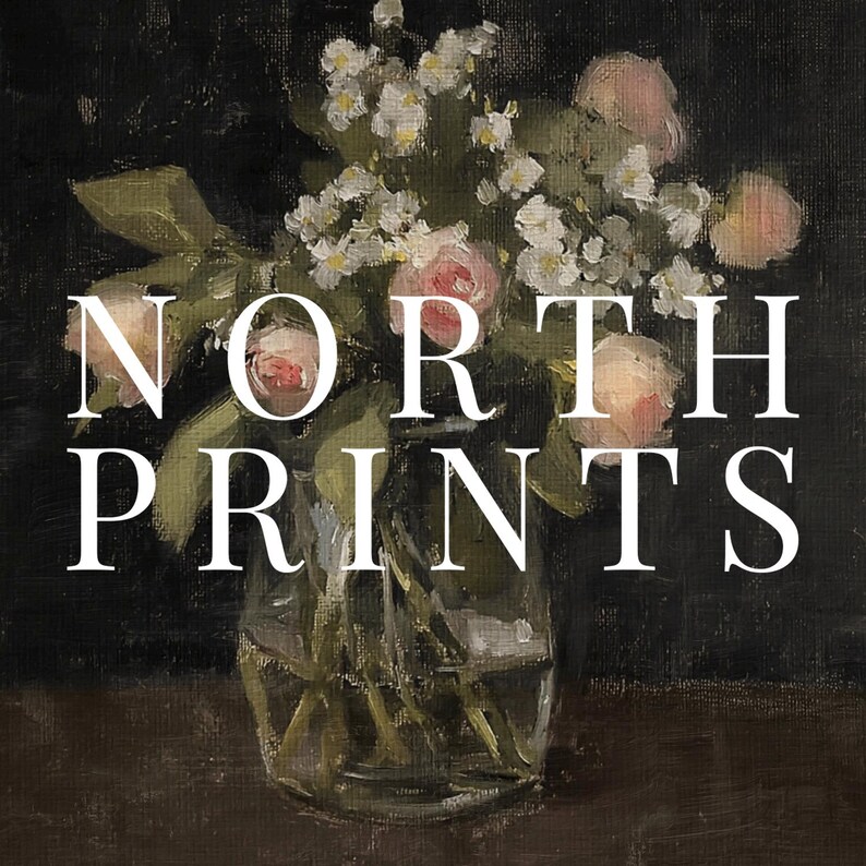 May include: A bouquet of pink and white flowers in a clear glass vase. The vase is sitting on a brown surface. The text "NORTH PRINTS" is superimposed on the image.