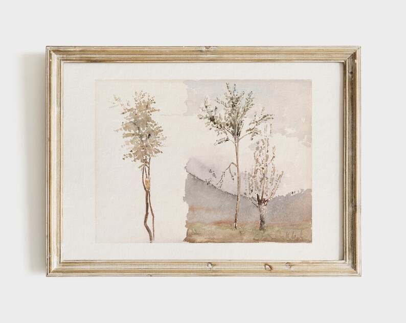 May include: A framed watercolor painting of three trees in a landscape setting. The trees are painted in shades of brown and green, and the background is a soft blue and gray.