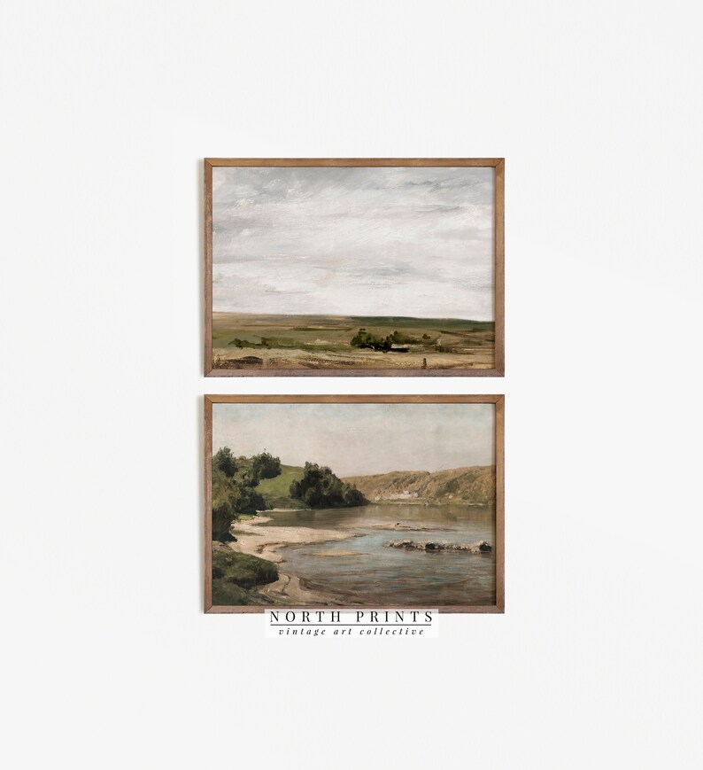 May include: Two framed landscape paintings. The top painting shows a field with a cloudy sky. The bottom painting shows a river with trees and a rocky shore.