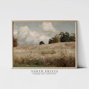 May include: A vintage painting of a landscape with a field of tall grass and trees in the background. The sky is cloudy and blue. The painting is framed in a gold frame.