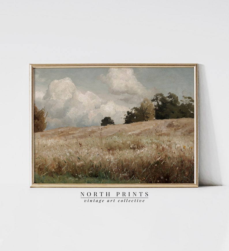 May include: A vintage painting of a landscape with a field of tall grass and trees in the background. The sky is cloudy and blue. The painting is framed in a gold frame.