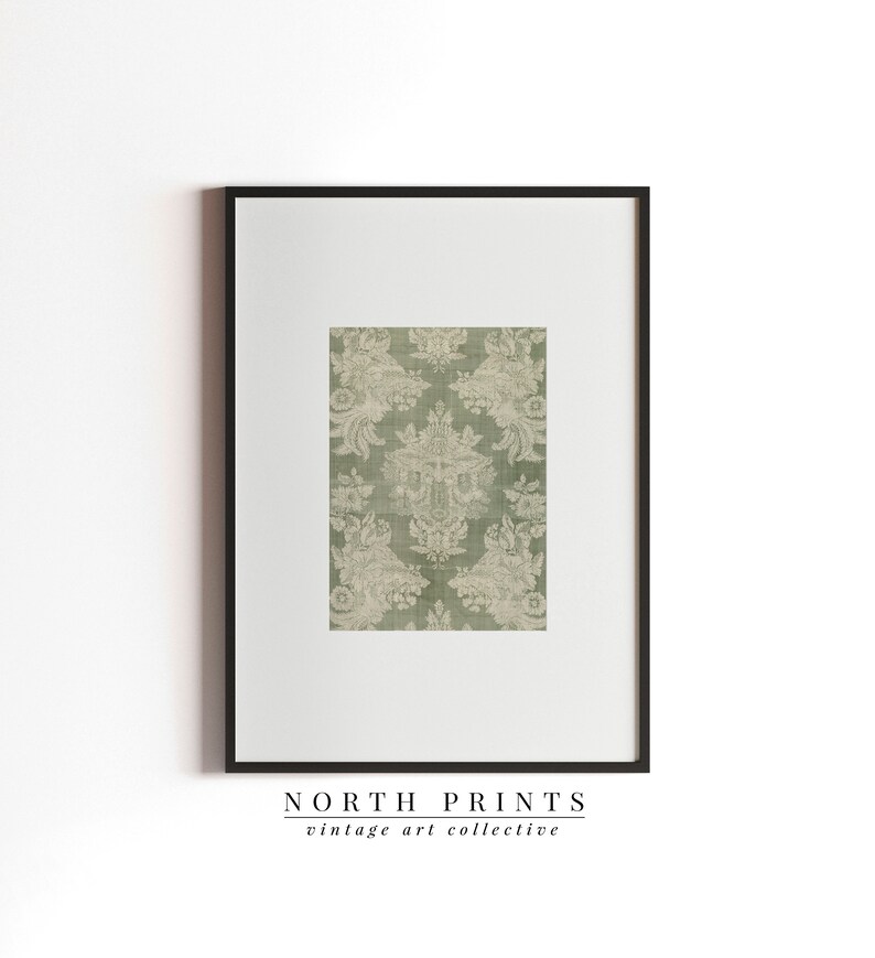 May include: A framed print of a vintage green and white damask pattern. The print is titled "NORTH PRINTS vintage art collective".