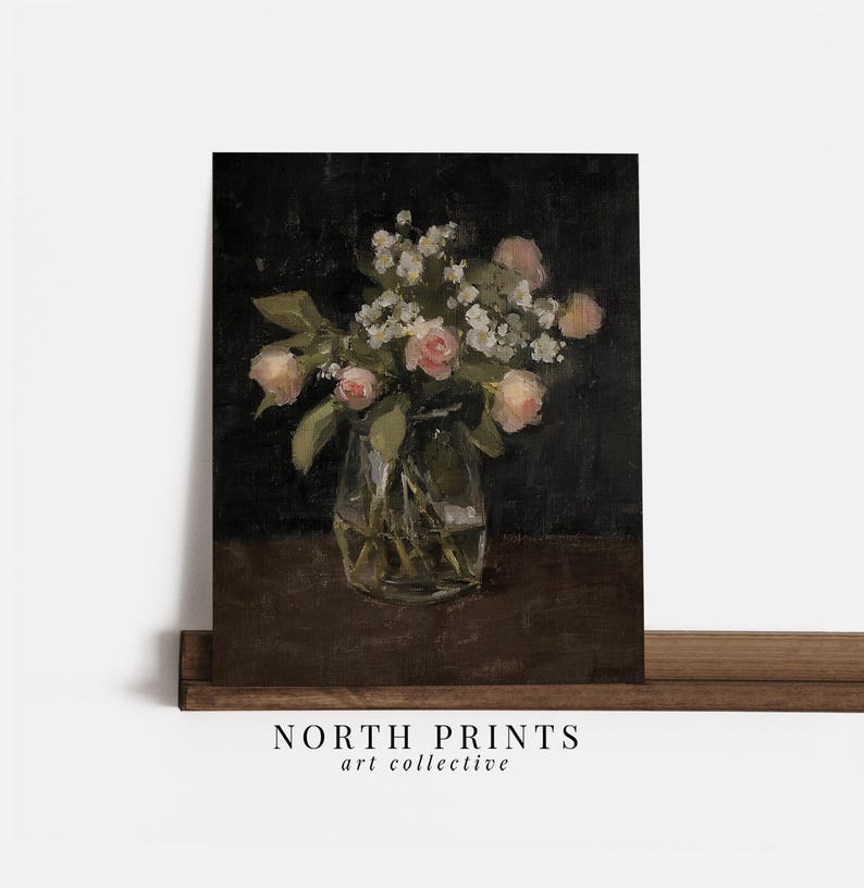 May include: A painting of a bouquet of pink roses and white flowers in a clear glass vase on a dark brown table.