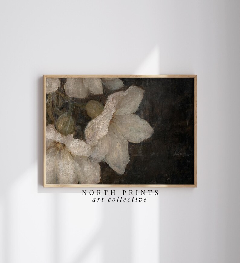 May include: A vintage-style painting of white flowers with a dark background. The flowers are painted in a realistic style with soft, delicate details. The painting is framed in a simple wooden frame.