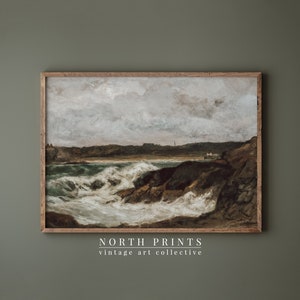 May include: A vintage painting of a seascape with crashing waves and a rocky coastline. The sky is cloudy and the water is a deep blue. The painting is framed in a wooden frame.