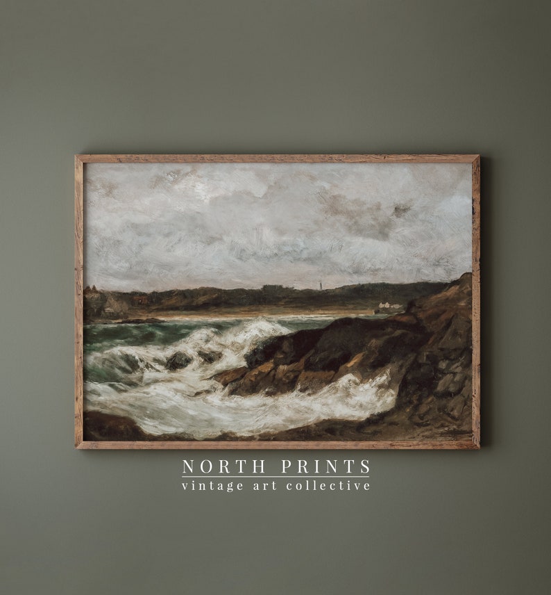 May include: A vintage painting of a seascape with crashing waves and a rocky coastline. The sky is cloudy and the water is a deep blue. The painting is framed in a wooden frame.
