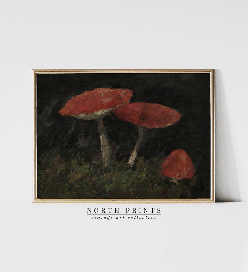 May include: A vintage painting of three red mushrooms with white stems growing in a dark forest setting. The painting is framed in a dark wood frame.