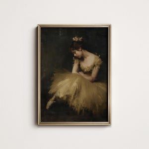 May include: A framed vintage painting of a ballerina in a golden yellow tutu and matching bodice. The ballerina is seated, with her head bowed. The painting has a dark background and is framed in gold.