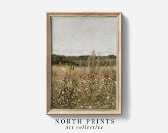 May include: A framed painting of a field of wildflowers in shades of brown, green, and white. The sky is a light blue with a few clouds. The painting is in a simple wooden frame.