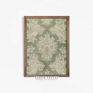 May include: A framed print of a vintage green and white damask pattern. The print is in a wooden frame with a light brown finish. The text "NORTH PRINTS vintage art collective" is at the bottom of the print.