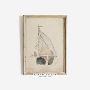 Puede incluir: Una pintura de acuarela enmarcada de un velero con una vela blanca y un casco marr&oacute;n claro. La pintura est&aacute; sobre un fondo beige y tiene un marco de madera claro.