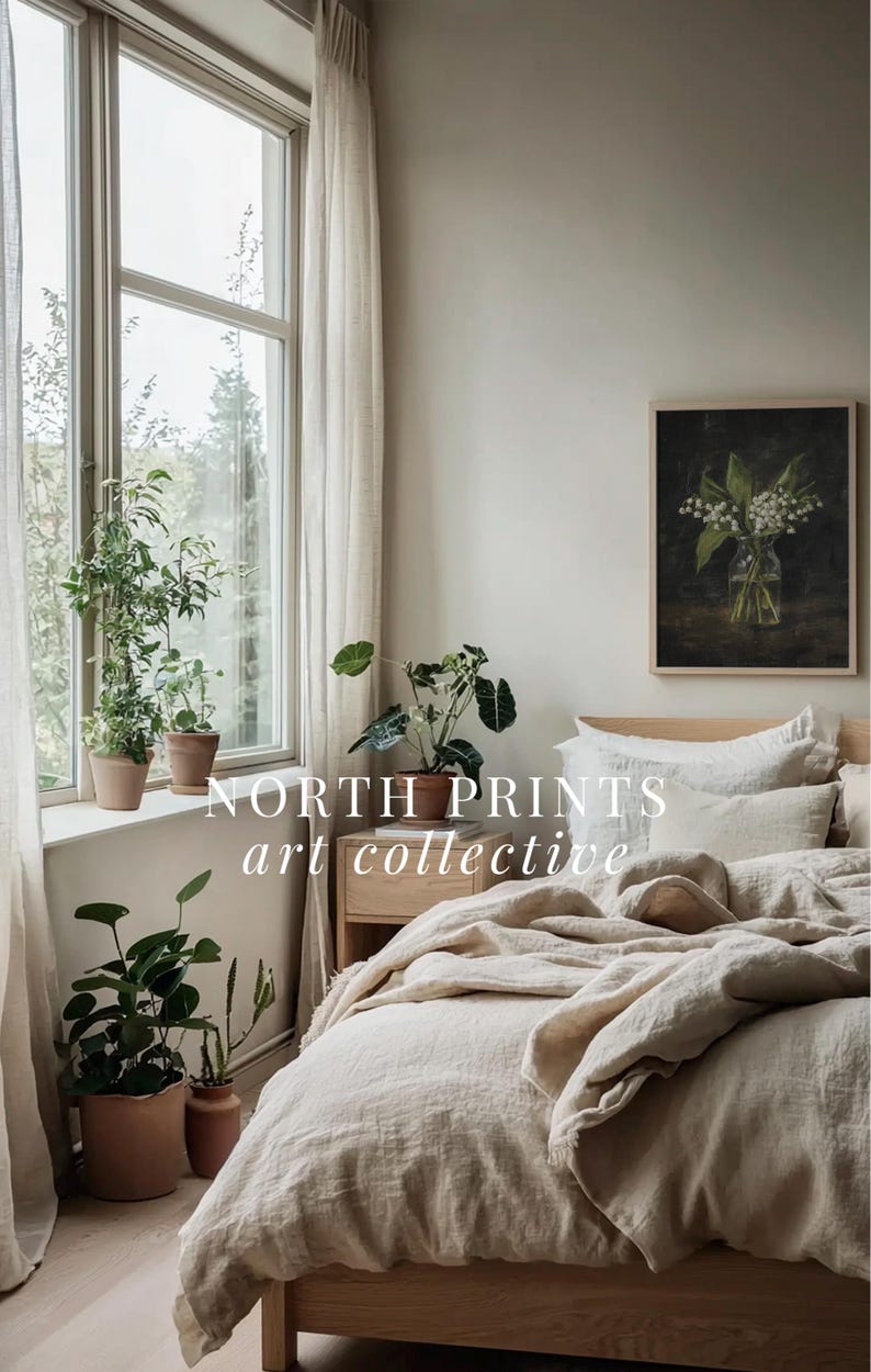May include: A bedroom with a bed made with a white linen duvet cover and pillows. A framed botanical print of a bouquet of white flowers hangs on the wall above the bed. The text "NORTH PRINTS art collective" is visible in the image.