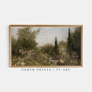 May include: A vintage-style painting of a garden scene with lush green trees and a variety of pink, white, and yellow flowers. The painting is framed in a light brown wood frame.