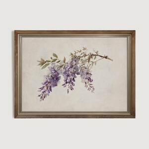 May include: A framed print featuring a watercolor illustration of wisteria blossoms. The artwork showcases cascading purple flowers and green leaves against a neutral background. The frame is a warm, natural wood tone, adding a touch of rustic charm to the floral art.