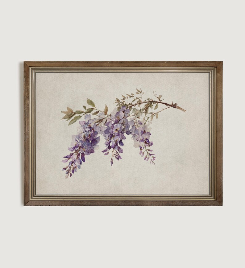 May include: A framed print featuring a watercolor illustration of wisteria blossoms. The artwork showcases cascading purple flowers and green leaves against a neutral background. The frame is a warm, natural wood tone, adding a touch of rustic charm to the floral art.