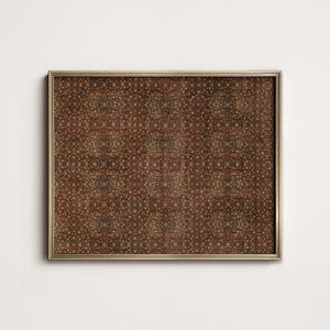 May include: A framed print with a detailed, repeating pattern in shades of brown, red, and gold. The pattern features small, circular shapes and intricate designs, creating a textured appearance. The frame is a thin, gold color, adding a touch of elegance.