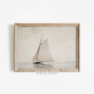 May include: A vintage watercolor painting of a sailboat on the water. The sailboat has a white sail and is sailing on a calm sea. The painting is framed in a light wood frame.