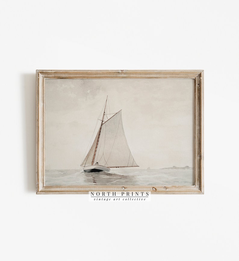 May include: A vintage watercolor painting of a sailboat on the water. The sailboat has a white sail and is sailing on a calm sea. The painting is framed in a light wood frame.