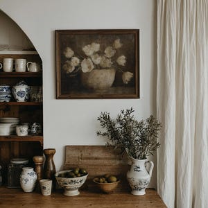 May include: A set of three ceramic mugs with a speckled, matte finish. The mugs are in shades of cream, light gray, and dark gray. Each mug has a simple, minimalist design and a rounded handle.