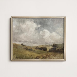 Könnte beinhalten: Gerahmtes Landschaftsgemälde mit goldfarbenem Rahmen. Das Kunstwerk zeigt einen hügeligen grünen Hügel unter einem bewölkten Himmel. Das Gemälde hat eine Vintage- und Antik-Ästhetik mit weichen Pinselstrichen und gedämpften Farben.