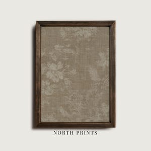 May include: A framed print featuring a beige floral pattern on a textured background. The print is enclosed in a dark brown wooden frame. The text "NORTH PRINTS" is printed at the bottom of the frame.