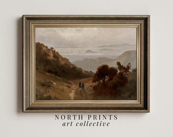 May include: A framed painting depicting a landscape with a mountain range in the distance. The painting is in a gold frame with a brown mount. The painting is set against a white wall.
