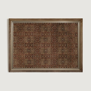 May include: A framed print with a detailed, repeating pattern in shades of brown, beige, and red. The symmetrical design features small, circular elements. The frame is a warm, light brown colour, enhancing the vintage aesthetic.