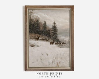 May include: A framed print of a winter landscape with a herd of deer in the snow. The deer are brown and have antlers. The trees are bare and the sky is cloudy. The print is in a brown frame with a gold trim.