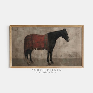 Puede incluir: Una impresión artística enmarcada que presenta una pintura estilizada de un caballo. El caballo es negro en el lado derecho y está cubierto con una manta roja en el lado izquierdo. El fondo es gris apagado con el texto "NORTH PRINTS art collective" en la parte inferior.
