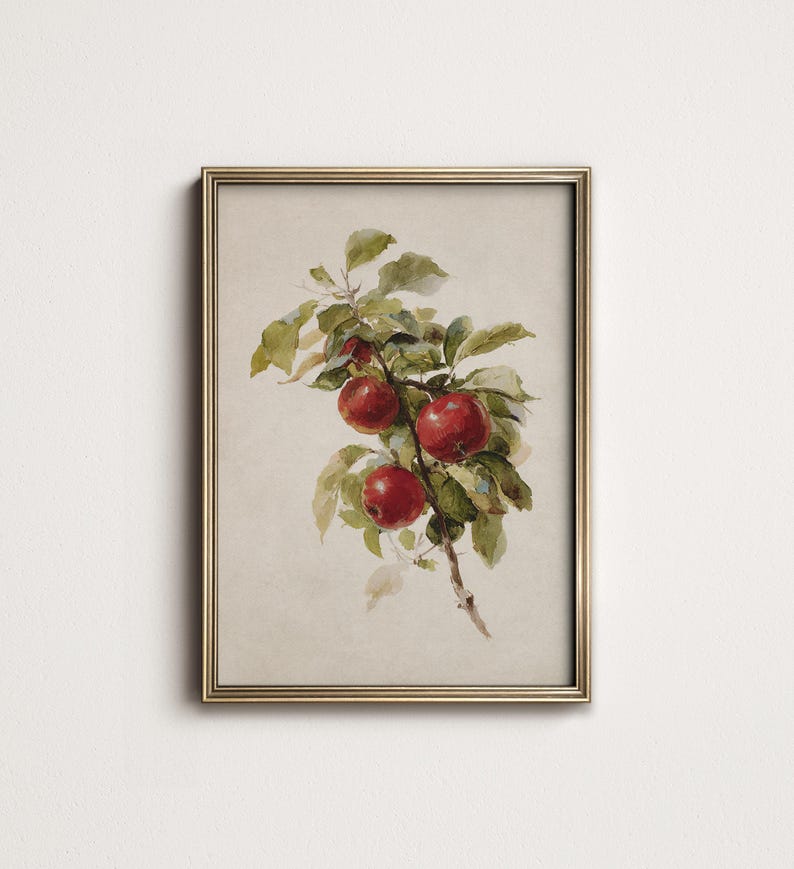 Peut inclure: Une impression encadr&eacute;e &agrave; l'aquarelle repr&eacute;sentant une branche de pommes rouges avec des feuilles vertes. L'&oelig;uvre d'art a une esth&eacute;tique vintage, avec un cadre dor&eacute;. Les pommes sont d'un rouge vif, contrastant avec le fond.