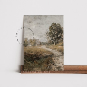 May include: A vintage art print featuring a painting of a country road leading to a small house with a tree in the foreground. The painting is done in muted tones of brown, green, and gray.
