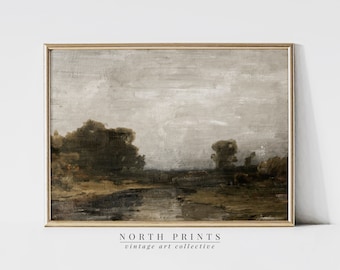 May include: A vintage landscape painting in a brown wooden frame. The painting depicts a muted brown and gray landscape with trees and a river. The sky is a light gray with white clouds. The painting is titled "NORTH PRINTS vintage art collective".