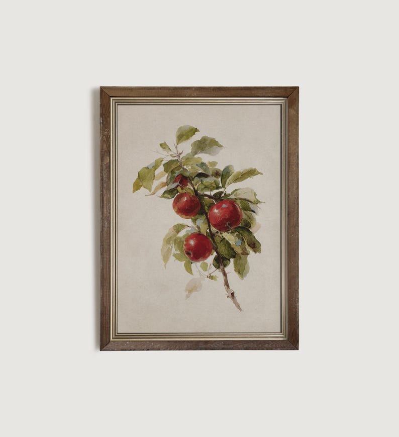 Peut inclure: Peinture &agrave; l'aquarelle encadr&eacute;e d'une branche avec des pommes rouges et des feuilles vertes. L'&oelig;uvre a une esth&eacute;tique vintage, avec un fond neutre et un cadre en bois marron. Les pommes sont d'un rouge vif.