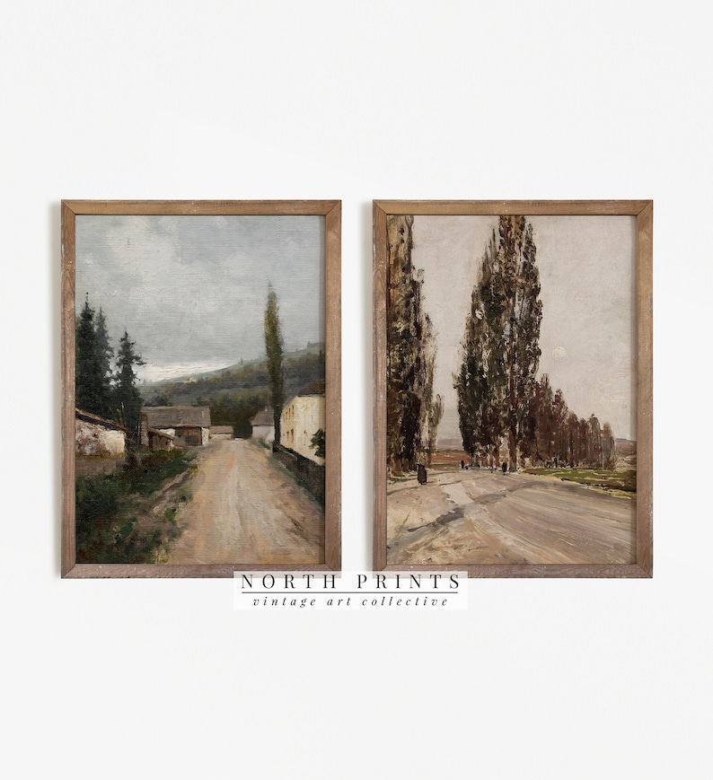 May include: Two framed vintage landscape paintings. The painting on the left shows a dirt road leading through a village with houses and trees. The painting on the right shows a dirt road lined with tall trees.