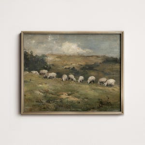 K&ouml;nnte beinhalten: Gerahmtes Vintage-Landschaftsgem&auml;lde mit einer Schafherde, die auf einer gr&uuml;nen Weide grast. Das Kunstwerk hat einen goldfarbenen Rahmen und zeigt einen bew&ouml;lkten Himmel und sanfte H&uuml;gel. Die Schafe sind wei&szlig; und die Farbpalette ist ged&auml;mpft.
