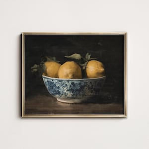 May include: A still life painting of three yellow lemons in a blue and white porcelain bowl. The bowl is on a dark brown surface. The background is dark.