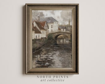 May include: A vintage painting depicting a charming village scene with a stone bridge spanning a river. The houses are white with red tiled roofs, and the river is surrounded by trees and greenery. The painting is presented in a brown wooden frame.