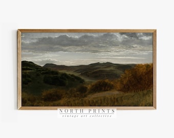 May include: A vintage landscape painting depicting a rolling green hillside with a cloudy sky. The painting is framed in a light brown wood frame. The text "NORTH PRINTS vintage art collective" is printed below the frame.