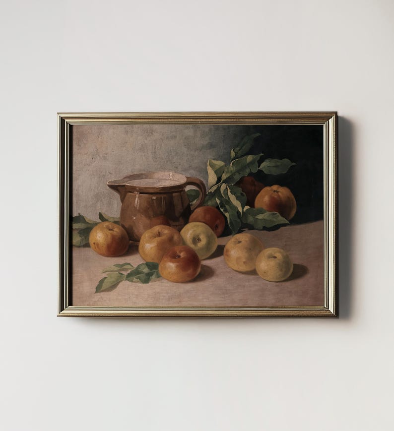 May include: A still life painting of a brown ceramic pitcher and a group of apples in various shades of yellow, green, and red. The apples are arranged on a table with green leaves and the pitcher is slightly tilted to the side.