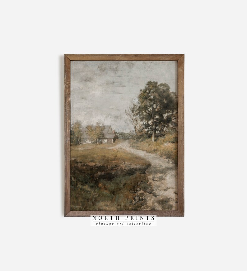 May include: A framed painting of a rural landscape with a small house in the distance, a winding path leading to it, and trees on either side. The sky is a muted gray with hints of blue, and the overall color palette is muted and earthy.